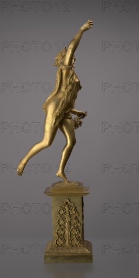 Candlestick, lyre iconographic, swans iconographic, 19th century, Paris, France, lighting, height 54 cm, A gilded statue of a human figure poised on one foot atop a decorative pedestal, shown in profile with one arm raised and the other lowered holding a small bunch of rounded shapes; the figure wears a flowing draped garment with textured edges and has long hair with ornamental details, the body and pedestal share a metallic gold color, set against a smooth neutral gray background.