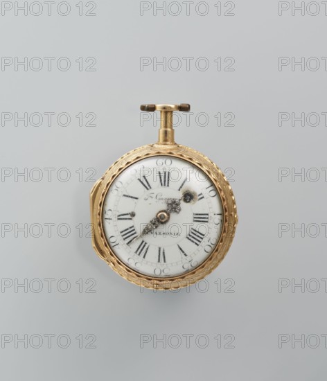 Pocket watch by Franciszek Gugenmus 1740–1820, watchmaker. Pocket watch in a gold case depicting symbols of the sciences on a rocaille base; white-enameled dial with Roman and Arabic numerals, openwork hands set with diamonds. Signature on the dial: Fr. Gugenmus / A VASOVIE. On the movement: Fr. Gugenmus / A VARSOVIE / No. 150. Dated to the 2nd half of the 18th century. Origin: Warsaw, Poland. Dimensions: height 6.5 cm, width 4.5 cm; weight 93.7 g., A round pocket watch with a white face and black roman-style markings, set in a decorative gold case with a patterned edge and a gold winding crown and T-shaped handle; the watch hands are ornate and metallic, and there is a small darkened area near the center; the background is a smooth light gray.