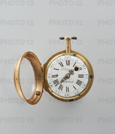 Pocket watch by Franciszek Gugenmus 1740–1820, pocket watch in a gold case depicting symbols of the sciences on a rocaille base; white-enameled dial with Roman and Arabic numerals, openwork hands set with diamonds. Signature on the dial: Fr. Gugenmus / A VASOVIE. On the movement: Fr. Gugenmus / A VARSOVIE / No. 150. Second half of the 18th century, Warsaw, Poland. Watch; height 6.5 cm, width 4.5 cm, weight 93.7 g., A round pocket watch with an open hinged cover sits against a pale grey background. The watch case and cover are metallic gold in color with a slightly worn, textured surface. The cover's interior shows gold tones and a clear circular glass insert. The watch face is white with black markings and ornate metallic hands attached to a central decorative hub in silver and gold tones. There is a winding crown and T-shaped stem at the top in gold with darker brownish ends. A thin greenish residue or discoloration appears near the watch bezel. The overall scene shows a few areas of ...