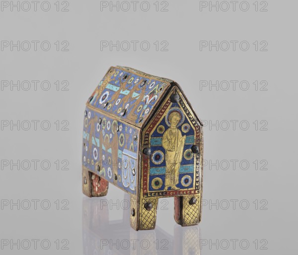 Reliquary box of Saint Valeria of Limoges, Saint Valeria of Limoges; Martialis Saint; bishop; 3rd century; cephalophoria iconography. Reliquary in the form of a box on legs with a gable roof, flap opening at the back; front wall and roof enamelled with scenes from the life of Saint Valeria. Narrative on the roof: at left a seated man gives orders to a young man in a short tunic a servant who hurries away; next a youth beheads a kneeling young woman with a sword. On the front, in a church, St. Valeria holds her own head and offers it to Bishop Martialis standing at the altar; behind her stands a young man with a lowered sword. Side panels show images of a saint, probably St. Martialis. Figure reserves are gold on a blue enamel background decorated with horizontal stripes and rosettes in white, green, red, and yellow; back decorated with large rhombus motifs filled with squares in blue and black. Date: 1210–1220. Origin: Limoges, France. Ritual object. Dimensions: height 13 cm, width 14....