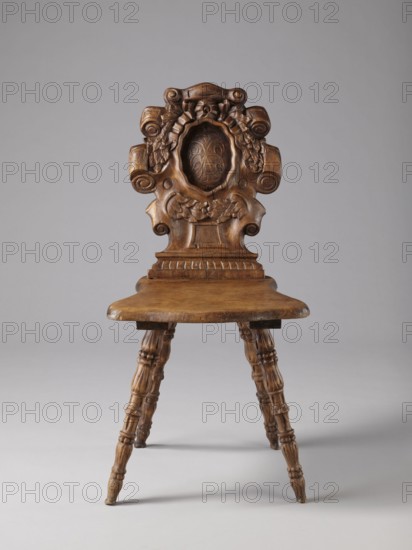 Stool, scrollwork ornament, neo-Renaissance style, cabochon ornament, ca. 1850, Warsaw possible place of origin, piece of furniture, seating piece, height 90 cm, width 44 cm, depth 45 cm, A wooden chair with an elaborately carved backrest featuring scrolls, floral garlands, and a central oval medallion, a smooth wooden seat with a slightly curved front edge, and turned wooden legs with decorative rings and grooves. The visible colors are brown in the wood and a neutral gray background.
