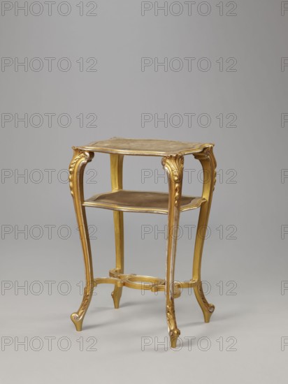 Side table, equipment of representative buildings of the Republic of Poland 1918–1939, unknown origin, plant decoration, acanthus ornament, volutes, neo-rococo style, 3rd quarter of the 19th century, Warsaw, furniture, table; height 77.3 cm, width 50 cm, depth 40 cm, A small ornate wooden stand with a gilded finish and a warm golden color, featuring a square top with slightly curved edges, a lower shelf, and four cabriole legs with carved decorative motifs; the legs curve outward and end in small scroll feet, and a stretcher connecting them has rounded elements. The background is a smooth neutral gray, and the surface beneath the stand is a slightly lighter gray.