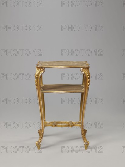 Side table, equipment of representative buildings of the Republic of Poland 1918–1939, unknown origin, plant decoration with acanthus ornament and volutes, neo-rococo style, 3rd quarter of the 19th century, Warsaw; furniture, table; height 77.3 cm, width 50 cm, depth 40 cm., A small ornate table with a gold finish stands against a plain light gray background; the table has a rectangular top with curved edges, a lower shelf, four slender cabriole legs with carved scroll and acanthus details, and a decorative stretcher joining the legs, all in gold tones with subtle darker shading.
