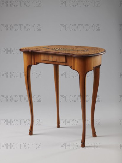 Table, Auxiliary table supported by four slender, slightly curved S-shaped legs framed and bound with a rosewood ribbon; feet in the form of hooves, stained black. Front frame concave with a small central drawer. Tabletop decorated centrally with a fan enclosed by four fields separated by a ribbon of irregular, rounded outline and a narrow crosswise frame. Fan setting inlaid with mother-of-pearl rosettes, bound with tin veining; lower part of the fan features alternating light and dark areas. Tabletop edge veneered with yew solid wood. Mortise lock, single-bolt with brass plate. c. 1730–1750, Saxony, furniture; height 72.5 cm, width 71.5 cm, depth 46.2 cm., A wooden side table with a kidney-shaped top sits on a light background; the table shows a warm honey-brown finish with darker brown edging and inlaid darker wood patterning on the top, and a subtle fan-shaped decorative motif in contrasting tones; the apron has a small recessed central panel and gently curved cutouts, and the table...