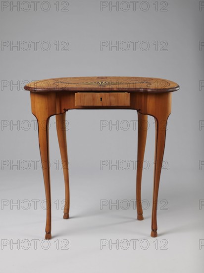 Table, Kidney-shaped auxiliary table, ca. 1730–1750, Saxony . Supported by four slender, slightly curved S-shaped legs framed and bound with a rosewood ribbon; feet shaped as hooves, stained black. Front frame concave with a small central drawer. Tabletop decorated centrally with a fan enclosed by four fields separated by an irregular ribbon and a narrow crosswise frame; fan setting inlaid with mother-of-pearl rosettes and bound with tin veining, lower part of fan showing alternating light and dark areas. Tabletop edge veneered with yew solid wood. Mortise lock, single-bolt with brass plate. Furniture — table. Height 72.5 cm, width 71.5 cm, depth 46.2 cm., A wooden table with a light brown finish and darker brown edging stands on slender curved legs; the tabletop is oval with a decorative inlay pattern radiating from the center in darker and lighter wood tones, and there is a small centered drawer beneath the top. The visible colors include light brown, dark brown, and subtle variation...