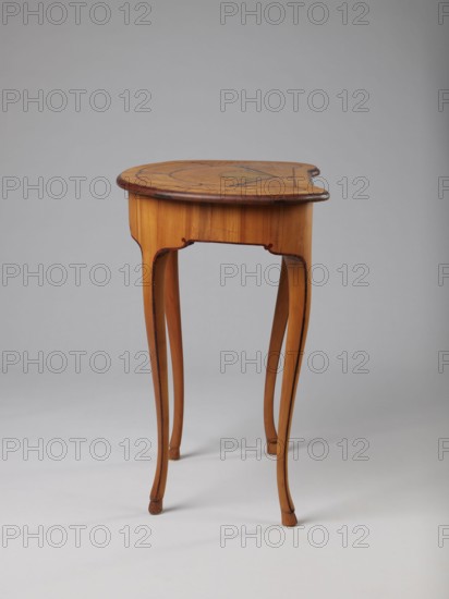 Table, Kidney-shaped auxiliary table supported by four slender, slightly curved S-shaped legs framed and bound with a rosewood ribbon; feet in the form of black-stained hooves. Front frame concave with a small central drawer. Tabletop decorated centrally with a fan enclosed by four fields separated by a ribbon of irregular, rounded outline and a narrow crosswise frame. Fan setting inlaid with mother-of-pearl rosettes and bound with tin veining; lower part of the fan features alternating light and dark areas. Tabletop edge veneered with yew solid wood. Mortise lock, single-bolt with brass plate. Circa 1730–1750, possibly Saxony. Furniture table. Dimensions: height 72.5 cm, width 71.5 cm, depth 46.2 cm., A small wooden table with a rounded top and slender, curved legs stands against a plain gray background; the table shows warm brown and honey-colored wood tones with darker brown edging and decorative inlaid patterns on the top, and the legs have subtle dark accents along their inner cur...