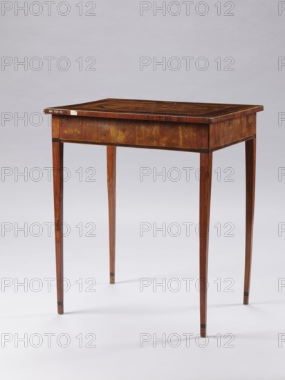 Table, figures in Eastern costume, figures against a landscape, palm trees, seascapes, sailing ships, monograms, Classicist rectangular inlaid table supported by four slender, angular, converging legs. On the tabletop, a rectangular field framed by a wide border with light veining, containing an inscribed oval bordered by a wide ribbon and veining. Inside the oval, a seaside landscape with a palm tree on the left and a castle on the right, and two men in Eastern costume standing at a round table with dishes and fruit. Between the S-shaped legs of the table are two bundles. At the bottom of the composition is a cartouche with the initials JJ TT ?. Late 18th century, Poland, furniture, table; height 73.5 cm, width 63.7 cm, depth 46.3 cm., A wooden table with a rectangular top and tapered legs stands against a plain light gray background; the table shows a warm brown wood grain with darker brown inlaid patterns on the tabletop and slightly darker bands near the leg ends, with overall colo...