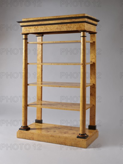 Shelf unit, columns architect, Biedermeier style, architectural elements, pilasters architect, birch, wall-mounted, with four rectangular shelves supported by four corner supports columns at the front, pilasters at the back mounted on a platform, supporting the profiled, architectural cornice of the upper wreath. Columns with smooth shafts. Plinths, bases, and capitals of the columns stained black. Shelves with a striped rim creating a kind of small, full gallery. Plate platform, on low block legs-pads, ca. 1830, Central Europe, piece of furniture for presenting objects, height 168 cm, width 105.5 cm, depth 49.5 cm, A freestanding wooden shelving unit with a light golden-brown wood grain finish and darker brown accents, standing against a neutral light gray background. The piece has a rectangular stepped top with dark brown trim, supported by a frame of vertical round columns at the front corners and rectangular supports at the back. Several flat horizontal shelves span between the sup...