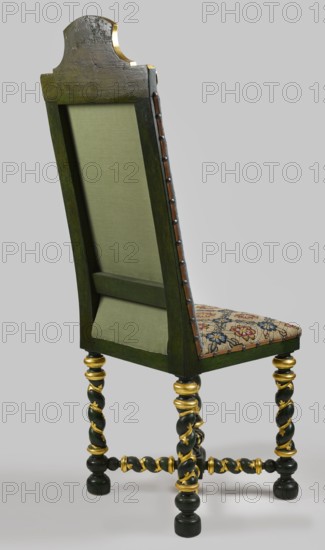 Chair, rosette ornament, coats of arms, crowns, Baroque style, Prus III coat of arms, CHAIR with spirally turned footrest elements, carved, painted, partly gilded and silver-plated, upholstered seat and backrest with embroidery on canvas, supported by four straight legs joined by turned links forming an X link at the bottom. Legs terminate in spools at the top, with spherical feet at the bottom, embellished with plant tendrils in the middle. At the intersection of the binding joints, a cube is topped with a turned pinnacle. High rectangular backrest with a bell-shaped finial decorated with a closed crown, below with crossed palm branches and acanthus leaves, and shells in the corners; originally with a gap. Angular backrest rails. Seat with embroidered net motif; backrest features the Prussian coat of arms on a paludament topped with a crown and jewel leg bent at the knee. 1710–1730, Poland; seating furniture; height 141 cm, width 50 cm, depth 51.5 cm., A tall wooden chair shown from t...
