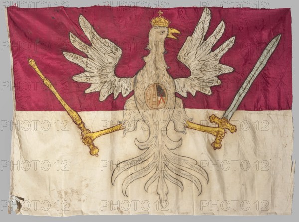 Infantry regiment pennant, pennants, Double-sided banner. Blue fabric made of two silk grosgrain fabrics sewn together: cream at the bottom and red at the top. In the center, a painted image of the White Eagle with a crown, holding a sword and scepter in its talons. On the eagle's chest, in an oval, is the two-field coat of arms of the electors of Saxony. Yellow paws, beak, sword hilt, and scepter are applied from yellow fabric. 1725–1750, Poland. Materials: fabrics. Height 83 cm, width 86 cm., A rectangular fabric flag with a horizontal two-color design, the top half in deep red and the bottom half in off-white, featuring a large stylized bird with outstretched wings and long flowing tail feathers occupying the center; the bird is rendered in pale beige with darker outline and feather detailing and wears a small golden crown, its beak shown open in yellow. The bird holds a long golden staff in one claw and a golden-handled sword with a silvery blade in the other, both weapons depicted...