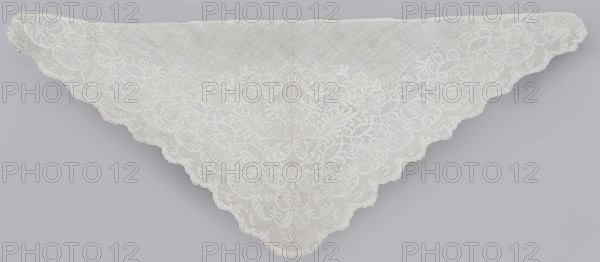 Shawl, repossession provenance; shawl; fashion accessory; clothing; women's clothing; 1st half of the 19th century also noted 18th century; Silesia place of origin; Saxony place of creation; white embroidery; Dresden lace; plant and floral patterns; ornament composed symmetrically around an axis passing through the centre of the shawl, occupying almost the entire surface; on the edge of two hypotenuse sides a geometric ornament: knitted serrations on the edge, above it a strip of fine mesh, separated from the plant ornament filling the space of the shawl by a series of arched forms; height 79 cm, width 34 cm., A triangular lace cloth displayed flat with scalloped edges and an intricate floral and foliate lace pattern; the cloth is predominantly white with delicate openwork and embroidered motifs, set against a pale gray background.