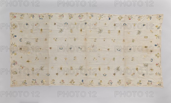 Church napkin tablecloth made of very thin linen batiste covered with multicolored silk embroidery. Ornamentation composed of evenly distributed small patterns of stylized flowers, fruit, animals, and birds. In the center a fox and a rooster, surrounded by blackberries, apples, plums, several varieties of pears, pea pods, acorns, hazelnuts, mushrooms, strawberries, gourds, tulips, lilies of the valley. Border is a narrow, shaded strip. Flat embroidery, pierced following the motif, double-sided, worked in silk threads in light yellow, light blue, sky blue, blue, pink, celadon, ochre, and gold and silver thread. Early 18th century, Poland. Material: fabrics. Dimensions: height 210 cm, width 100 cm., A rectangular light beige textile laid flat with a visible border and scattered small embroidered floral and botanical motifs across its surface; the embroidered details include leaves, buds, and small flower shapes in colors such as blue, pink, yellow, green, and a muted gold, with some moti...