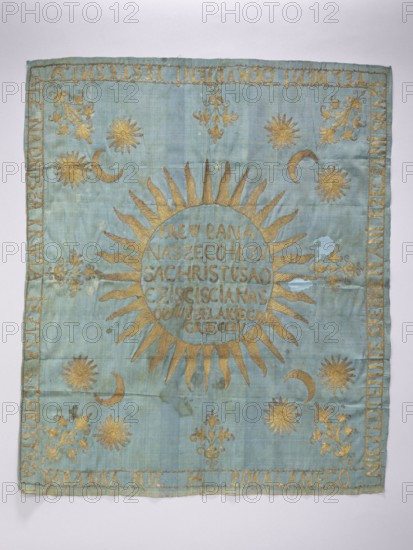 Church napkin. Blue silk rep cloth embroidered with gold thread. In the center, within a radiant halo, a sun with the inscription in Polish: THE BLOOD OF OUR LORD JESUS IS CHRIST, WHICH PURIFIES US FROM ALL SIN. Corners show stylized bouquets of flowers in an Eastern style, with a crescent and two stars above each; a similar bouquet appears at the center of each edge. Along the edges an inscription in Polish: NOT WITH GOLD, NOT WITH SILVER, NOT WITH THINGS CONTAMINATED, WE REDEEMED YESTESMI, BUT THE BLOOD OF JESUS CHRIST, THE UNDAMAGED LAMB. Resplendent fabric density: 36 weft threads and 29–32 warp threads per cm. One workshop edge preserved, the other cut. Embroidery with gold thread on a yellow silk ground, laid stitches, stitched with yellow silk thread. 17th–18th century, Poland. Height 67.5 cm; width 57 cm. Materials: silk, gold thread. Function: church furnishing/sacred textile., A square textile with a pale blue-green background embroidered in gold thread, showing a large styli...