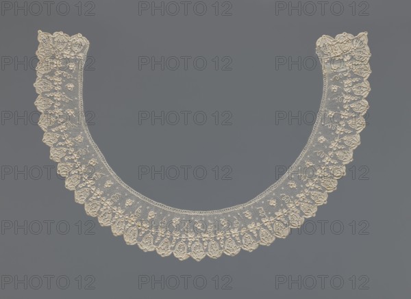 Collar, Repossession, Women's clothing accessory, lace, 19th century, France . The collar is a band of equal width, arched, with a floral ornament set against a mesh background. On the rim is a row of flower calyxes branching from a continuous branch decorated with small quatrefoils. Width 3.5 cm, length 46 cm., A delicate circular lace collar displayed against a plain background, the lace rendered in a creamy off-white color with intricate floral and scalloped edge patterns, the background a uniform medium gray; the collar shows a fine netting with embroidered floral motifs and a repeating scalloped border, creating a symmetrical rounded shape.