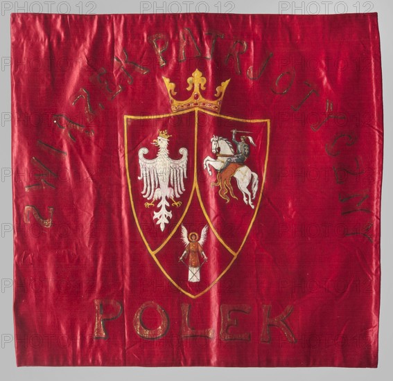 Pennant of the Polish Women's Patriotic Union. One-sided blue ribbon made of red silk fabric. In the center, an oil-painted three-field shield under a crown with the coats of arms of Poland White Eagle, Lithuania Pursuer, and Ruthenia Archangel with swords. Around the inscription: POLISH WOMEN'S PATRIOTIC UNION. Early 20th century, Poland. Materials: fabrics; height 61 cm, width 64 cm., A red square fabric with a glossy texture fills the image, showing creases and a few subtle shadows; near the center is a shield outlined in gold divided into three sections, topped by a gold crown; the left shield section contains a white eagle with a small gold crown, the right section shows a white horse ridden by a figure in dark clothing and a gold saddle, and the lower section has a small figure with white wings and a brown garment; the gold outline and crown, white figures, dark clothing on the rider, and brown and gold accents contrast with the red background.