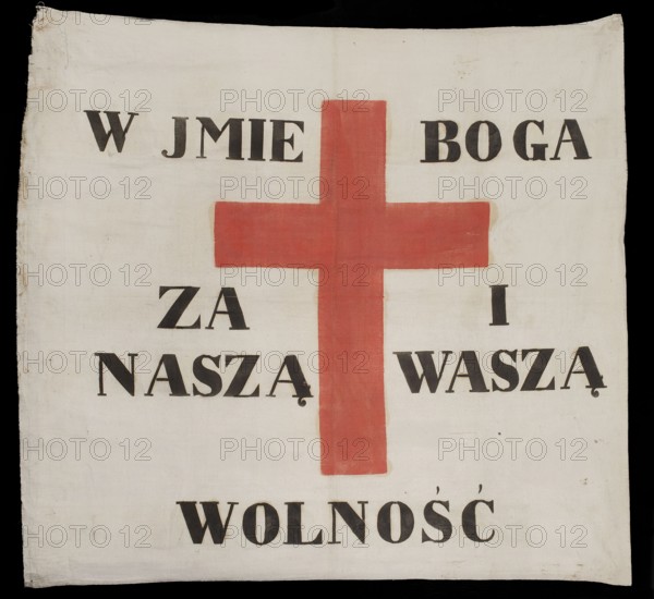Banner, propaganda banner from the November Uprising 1830–1831. Double-sided white cloth banner painted with a red cross; around the Latin cross an inscription in Polish painted in black: IN THE NAME OF GOD FOR OUR AND YOUR FREEDOM. The reverse bears an identical cross and the same inscription in Cyrillic Russian. Tradition holds it was scattered among Russian troops for propaganda purposes. Made of fabric, 1831. Height 108.5 cm, width 110.5 cm., A square fabric panel with a large red cross painted near the center, set against an off-white background; there are several black painted block letter shapes arranged above, beside, and below the cross creating a composed layout; the fabric shows slight wrinkles, faint discoloration, and small stains, with the edges appearing a bit frayed.