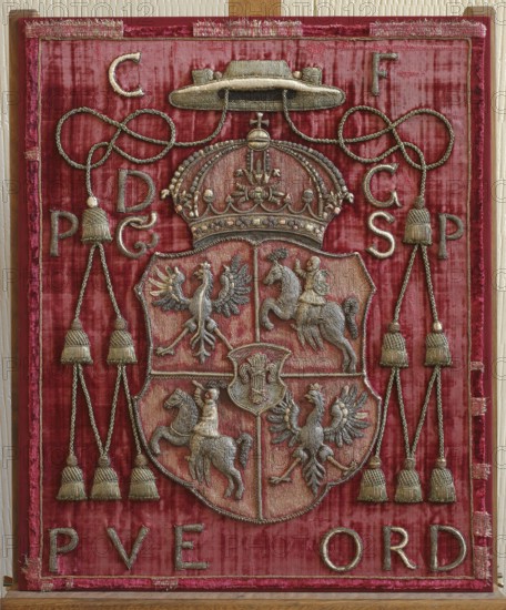 Back of a throne or bishop's chair made of red velvet with an applied coat of arms of the Polish–Lithuanian Commonwealth and a Vasa sheaf. Around the coat of arms cartouche are the letters: CF/DG/PG/SP/PVE/ORD Carolus Ferdinandus Dei Gratia Poloniae et Sveciae Princeps. Plocensis, Vratislaviensis Episcopus, Oppoliensis Ratiboriensie Dux. The embroidery on the back shows the two coats of arms of Poland and Lithuania with the Vasa sheaf in the middle. Karol Ferdinand Vasa 1613–1655, a Polish prince, was Bishop of Wroclaw from 1625 and Bishop of Plock from 1643; in 1651 he became administrator of the Duchy of Opole–Racibórz. Embroidery technique: all elements embroidered on a separate base and reapplied; raised embroidery on a linen canvas base with linen threads; laid-back gold embroidery. Metal threads: plate braided on silk thread and drawn wire thread. Small elements embroidered with silk, satin and knot stitch. Attributed to ca. mid-17th century, Poland. Materials: fabrics. Dimension...