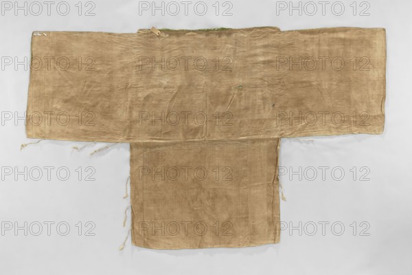 Church napkin, church paraments, Evangelical churches furnishings, Sereje Lithuania; furnishings, flowers, leaves, plant ornaments, sacred art, churches and chapels furnishings, 17th century, Italy place of origin, fabrics; height 180 cm, width 301 cm, A flat laid textile shaped like a wide T with a rectangular central panel and broad horizontal extension, the fabric appearing worn and slightly wrinkled with a few loose threads along its edges; the visible colors are tan brown for the main textile, small areas of green along the top edge, and a pale gray background beneath the textile.
