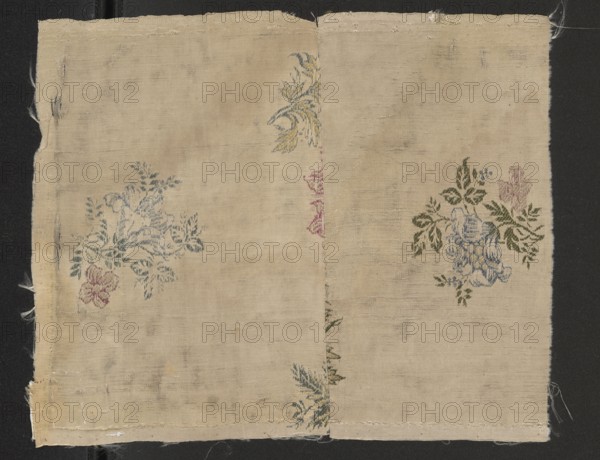 Fabric fragment, fragments of silk patterned fabric with preserved selvedge; floral bouquet motifs brocaded with colorful threads pale pink, dark pink, plum, light green, white, blue, lemon, cream, olive green on a white grosgrain-weave background. Border width: 0.4 cm. Motif height: 7.4 cm. 18th century, France. Height 23.5 cm, width 28.8 cm., A rectangular piece of woven fabric with a light beige background laid flat against a dark backdrop, showing frayed edges and a central vertical seam; several floral embroidery motifs are visible, including a cluster with blue and green leaves and a pale blue flower accompanied by olive green leaves and a smaller pink blossom, another cluster with muted blue-green foliage and a small pink flower, a decorative yellow and blue curved motif near the top center, and a few small greenish sprigs near the bottom; overall colors present include beige, blue, green, pink, yellow, olive, and dark background black.