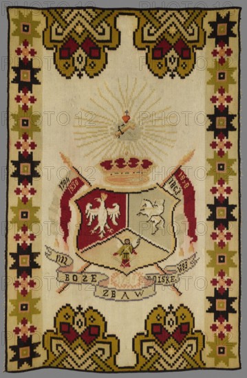 Kilim, Baraniuk fl. ca. 1890–1910. Kilim, 19th/20th century, Chortkiv Ukraine. Decorative tapestry/fabric, height 173 cm, width 115 cm. In the centre is a three-field cartouche with the White Eagle, Pogon, and an angel with swords. The coat of arms is topped by a crown and a heart with a cross within rays. Next to it are two banners with the dates 1794, 1830 and 1848, 1863. Below is a banderole with the inscription and dates: 1772 God save Poland 1793. No border; longer sides have geometric star motifs, shorter sides have stylized palmette motifs. Colors: light beige background with ornament in brown, red, and olive. Themes: coats of arms, emblems, Poland; associations with the Kosciuszko Uprising 1794, November Uprising 1830–1831, January Uprising 1863–1864, and the Partitions of Poland 1772–1795., A rectangular woven textile with a light beige background and a patterned border in olive green, black, dark red, pink, and pale yellow, featuring geometric floral motifs along the sides an...