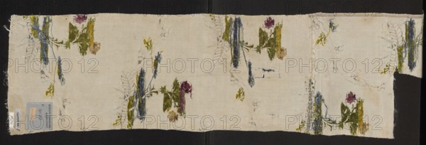 Fabric fragment, silk fabric fragment, patterned silk, 18th century, France. Preservation: fragments with preserved selvedge edge width 0.7 cm. White background with a grosgrain weave Gros de Tours with a small liseré motif, brocaded with colorful threads depicting delicate rose twigs and silver twisting vine-ribbons. Brocade thread colors: green, celadon, lemon, pale pink, pale blue, raspberry, plum, paint. Metal threads: silver lamellar, frisé silver, and metal thread with silver braid S. Dimensions: length 39 cm report, overall height 98 cm, width 23 cm., A rectangular piece of light-colored fabric lies flat against a dark background, with frayed edges and a narrow strip folded at one end; scattered across the fabric are a few floral motifs rendered in painted and stitched textures showing greens, blues, purples, yellows, and browns, with some areas of loose thread and faint pencil or ink sketch lines tracing leaf and stem shapes; the fabric surface shows slight creases and irregula...