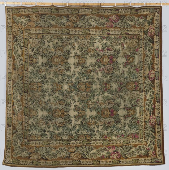 Court kilim, visual documentation, manor and home furnishings, decorative fabrics, plant ornaments, Poland culture. The main field of the kilim is filled with flower and leaf motifs arranged symmetrically in repeating rhomboid arrangements. It is surrounded by a three-stripe border; in the middle, widest strip, there is a floral garland motif, and in the narrow outer strips, floral and leafy tendrils. Colors: the background of the central part is off-white, and the borders are tobacco-colored; ornamentation in green, magenta, tobacco, white, and black. Ca. 1850. Place of origin: Poland. Material: fabrics. Height 218 cm, width 215 cm., A square woven textile with an overall muted green background decorated with a dense floral pattern in shades of green, brown, beige, and touches of pink and red, framed by a wide ornamental border featuring leafy and floral motifs in green, brown, beige, and pink on a brownish band, with narrower inner borders in similar earthy tones; the flowers and lea...
