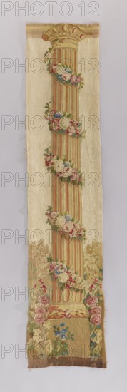 Ornamental tapestry, flowers, leaves, floral ornaments, columns, fabrics, interior decorations, interior furnishings, decorative fabrics. The column is identical to those flanking the pastoral scene in another tapestry. Identical colors: cream, red, pink, green, and yellow. 1750–1780, France. Fabrics; height 225 cm, width 48 cm., A long narrow textile panel showing a single tall fluted column with a decorated capital, wrapped at intervals with garlands of flowers; the background is a pale cream color and the column features warm beige and muted red vertical stripes, with accents of gold. The flower garlands include shades of pink, red, white, blue, and green foliage. The lower section shows a base and surrounding floral arrangements in tones of beige, brown, pink, blue, green, and gold. The overall palette is soft and muted with cream, beige, gold, pink, red, blue, and green.