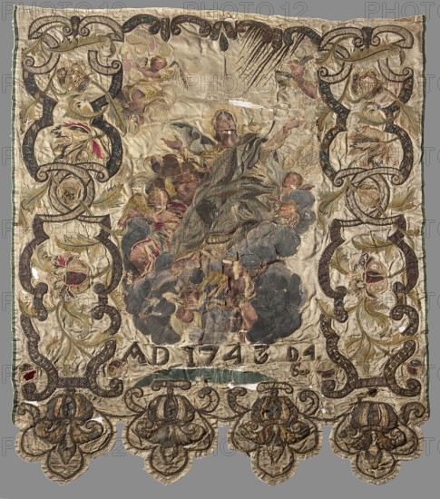Church banner, banners, vexils, Assumption iconography, Wojciech Kolasinski 1852–1916, angels, Mary mother of Jesus Christ, patterned fabrics, flowers, ribbon-pincer ornament, floral patterns, fabrics with preserved selvedge. Background of cream satin. Around the central embroidery, a wide border partly embroidered and partly appliquéd with cuttings, with a motif of flowers, twigs and leaves among the ribbon ornament. The lower edge is serrated. 1743, Poland. Fabrics; height 123 cm, width 105 cm., A large rectangular textile with a pale beige background featuring an ornate embroidered border and central scene, showing a group of human figures and angelic figures among billowing cloud-like shapes; colors visible include beige, cream, gold, brown, dark gray, blue, green, red, pink, and black. The border contains scrolling vine and floral motifs in gold, brown, green, and touches of red and blue, with repeated rounded decorative elements along the lower edge forming scalloped lobes. The c...