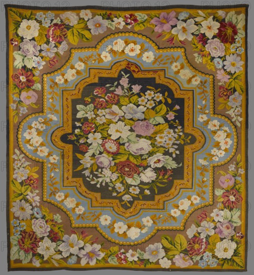 Kilim, In the center, a rosette — a bouquet composed of various species of flowers — surrounded by a double polygonal medallion whose frames are decorated with floral garlands. The remainder of the fabric — from the medallion to the edges — is filled with motifs of four bunches of flowers and leaves radiating from the corners. The kilim is edged with two narrow, smooth borders. Colors: backgrounds are black, yellow, and blue; ornament in red, purple, green, yellow, and white. ca. 19th century, Poland. Decorative fabric kilim. Dimensions: approx. 307–305.5 cm height × 328 cm width., The image shows a rectangular woven textile with an ornate floral design and a decorative central medallion. The overall colors include brown, gold, light blue, black, green, white, pink, purple, red, and yellow. A central dark panel contains a large cluster of various flowers and leaves in shades of white, pink, purple, red, and green. Surrounding this is a scalloped multi-layered border with gold and light...