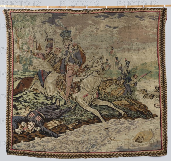 Kilim depicting the death of Prince Józef Poniatowski, after Horace Vernet 1789–1863 and an unknown author, early 19th century 1st half, wool fabric tapestry, height 213 cm, width 220 cm. Scene: on the right a river, center Prince Józef and his soldiers, upper left the outline of a city; colors: brown, cream, red, blue., A woven scene shows a group of figures and horses in an outdoor setting rendered in muted colors including beige, tan, brown, green, blue, pink, and red. A central figure in a decorative uniform with a tall hat rides a pale horse that is stepping forward, while nearby another rider on a darker horse gestures outward. Several other figures in uniform appear in the middle and background, some carrying long poles or rifles. In the foreground, a fallen figure lies on the ground wearing a dark coat with lighter trim. The landscape includes grassy mounds, rocky ground, and a body of water depicted with pale and grayish tones, and a round object floats near the water’s edge. ...
