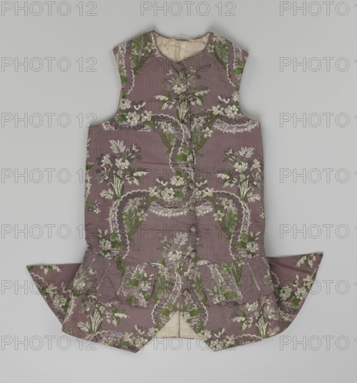 Vest, floral ornaments, patterned fabrics, Henryków German: Heinrichau - museum repository, fastened to the neck with 11 buttons. Flaps on the sides, below them 4 buttons as for the fastening, embroidered in gold. The back is made of brown canvas at the top and fabric at the bottom as on the front. 1750s, Silesia, garment, length 76 cm, A sleeveless garment laid flat against a light gray background, made of a mauve fabric with narrow vertical stripe texture and an all-over floral pattern; the flowers and foliage are depicted in shades of white, green, and muted brown, arranged in ornate, looping motifs with scalloped edges; the garment has a rounded neckline, a central fastening with a vertical row of fabric-covered buttons, a fitted bodice leading to a dropped, flared skirt with pointed side panels, and a visible inner lining in a pale beige color.