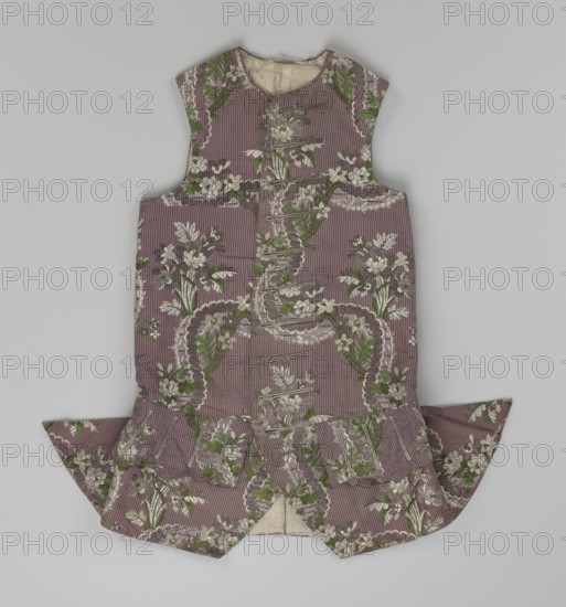 Vest, floral ornaments, patterned fabrics, Henryków German: Heinrichau - museum repository, Fastened to the neck with 11 buttons. Flaps on the sides, below them 4 buttons as for the fastening, embroidered in gold. The back is made of brown canvas at the top and fabric at the bottom as on the front. 1750s, Silesia, garment, length 76 cm, A sleeveless garment laid flat with a fitted bodice and a flared skirt-like extension, patterned with vertical subtle stripes and ornate floral motifs; the fabric shows a muted mauve or dusty rose background with pale cream flowers and green leafy accents, darker olive green foliage, and touches of brown in the decorative details, while the inside lining visible at the neck and skirt opening is a natural off-white or beige.