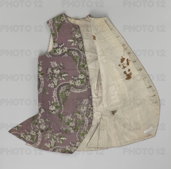 Vest, floral ornaments, patterned fabrics, Henryków German: Heinrichau - museum repository, fastened to the neck with 11 buttons; flaps on the sides with 4 buttons below them for fastening; embroidered in gold; back made of brown canvas at the top and fabric at the bottom as on the front; 1750s, Silesia; garment; length 76 cm., A sleeveless garment laid flat showing an outer patterned fabric and an inner lining, with the outer fabric in a muted purple color featuring a floral design in green and off-white and scalloped decorative motifs, and the inner lining in an off-white or cream color with a few brown stains and darker seam lines.