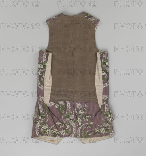 Vest, floral ornaments, patterned fabrics, Henryków German: Heinrichau - museum repository, fastened to the neck with 11 buttons. Flaps on the sides, below them 4 buttons as for the fastening, embroidered in gold. The back is made of brown canvas at the top and fabric at the bottom as on the front. 1750s, Silesia, garment, length 76 cm, A sleeveless garment laid flat showing its back side with a central panel of brownish fabric flanked by side panels of a patterned textile; the patterned areas are mainly mauve with pale stripe effects and floral motifs in green and off-white, and there are inner pale beige side linings visible; the lower skirt section shows gathered patterned fabric with the same mauve, green, and off-white floral design, and the neckline and arm openings reveal small sections of the patterned mauve and green fabric against the brown center.