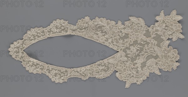 Collar, origin unknown, floral ornaments, clothing accessory for women's fashion, embroidery, connected at the bottom by a wide, irregular inset, 2nd half of the 19th century, Europe, width 19 cm, length 50 cm, A delicate piece of lace with intricate floral and leafy embroidery lies flat against a smooth background, showing an elongated oval opening flanked by ornate scalloped edges and a larger, more elaborate cluster of embroidered flowers and leaves at one end; the lace is a light beige or cream color with detailed looping and swirling threadwork, and the background is a muted medium gray.