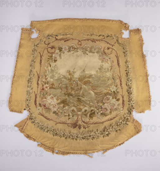 Tapestry hangings, varietals, message provenance, flowers, floral ornaments, fabrics, tapestries, interior furnishings, decorative fabrics, weaving, dogs, female figures, figures, furniture upholstery, genre scenes against a landscape background. Seat with a depiction of a dog sitting on grass, stage surrounded by a floral and acanthus border. Predominant colors: beige background, green, pink, and brown. The backrest depicts a young woman in a theatrical costume against a garden background. The scene is framed by a floral and acanthus border in the same tone as the seat. Armrests with a garland of blooming jasmines. 18th century, France. Fabrics. Height 75 cm, width 78 cm., A large worn textile panel with a central painted scene framed by ornate floral and ribbon motifs, showing a muted palette of gold, beige, cream, green, brown, pale pink, and soft red tones; the outer field is a warm golden yellow with frayed and torn edges and a few missing sections, while the central area is light...