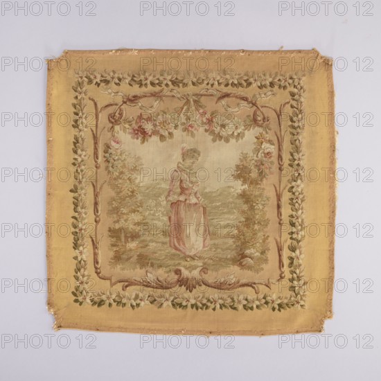 Tapestry hangings, varietals, message provenance, flowers, floral ornaments, fabrics, tapestries, interior furnishings, decorative fabrics, weaving, dogs, female figures, figures, furniture upholstery, genre scenes against a landscape background. Seat with a depiction of a dog sitting on grass, stage surrounded by a floral and acanthus border. Predominant colors: beige background, green, pink, and brown. The backrest depicts a young woman in a theatrical costume against a garden background. Scene framed by a floral and acanthus border in the same tone as the seat. Armrests with a garland of blooming jasmines. 18th century, France; fabrics; height 75 cm, width 78 cm., A square woven textile with a yellow-beige background and a central scene showing a standing woman wearing a dress in muted pink and cream tones, framed by a decorative inner border of leafy vine motifs in green and brown and floral garlands in pink, cream, and green; the outer plain border is a warm golden yellow with sli...