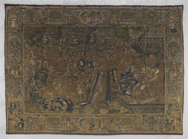 Figural tapestry, tapestries, fabrics, biblical scenes, decorative fabrics, interior furnishings, interior decorations, court scenes, weaving, scenes against a landscape background, borders. In the foreground, on the right, on a throne under a canopy sit two male figures in hats; in front of them stands a woman, behind her a small child, and another woman kneeling. Around them are other figures of women and armed men. In the background is a mountain landscape. Border with plant motifs and female figures; in the upper and lower centers are medallions with small scenes. Colors: green, sand, blue, gray, yellow. 4–5 warps per 1 cm, 10 wefts per 1 cm, wool, silk, wool warp, tapestry technique, numerous visible chains — also used in connecting shades of leaves small color fields and stitched technical slits. 16th century, Flanders, fabrics, height 338 cm, width 462 cm, A large woven tapestry with an ornate border surrounding a central scene, rendered in muted tones of gold, blue, green, brow...
