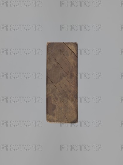 Double-sided gingerbread mould. Side A: bison; Side B: three figures—a bachelor in early-19th-century costume hat, justokor, artificial trousers, high boots, a baby in swaddling clothes decorated with a plant twig, and a long-bodied scaled fish. Rectangular wooden mould with engraved date 1806; letter S superimposed on an anchor manufacturer's or maker's mark. Materials: wood; function: form for gingerbread. Style/ motifs: figurative scenes, human figures, zoomorphic motifs, folk art/folk customs, Striding Bull iconography. Dimensions: height 19.5 cm, width 10.5 cm, depth 4.3 cm. Date: 1806. Place/region: Province of Silesia 1742–1918. Maker: unknown woodcarver or gingerbread maker., A rectangular block of wood with rounded corners suspended against a smooth light gray background, the wood showing a range of brown tones from light to dark with visible grain patterns, several narrow dark cracks and lines running across its surface, and subtle areas of darker brown staining and wear arou...