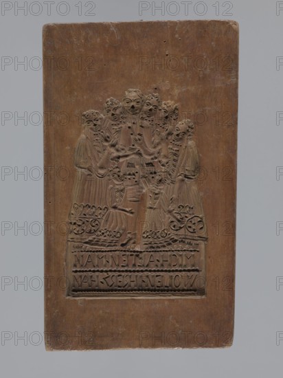 Double-sided gingerbread mould. Obverse: group of figures—two women and a child; rectangular form; one side shows three figures in 17th–18th century costumes: two women in long patterned dresses with low necklines and wigs, a child probably a boy in a long shirt, culottes and stockings holding a toy; both women hold baskets and one holds a hare; a small dog at the bottom next to a basket; beneath an inscription in German: LIEBES KIND DENCK DOCH / NECHEN WELCHEN KAM GERG, NOCH. Reverse: scene of a man surrounded by five women and two girls, all in 17th–18th century costumes; the man wearing a justaucorps, culottes and stockings, the women and girls in long patterned dresses with low necklines; German inscription at the bottom: MICH ALTEN MAN / WOLEN IHRER HAHN. Material: gingerbread mould for gingerbread; decorative art, figurative genre scenes, moral satire, plant ornaments;, 19th century; Province of Silesia 1742–1918. Dimensions: height 28 cm, width 17.3 cm, depth 4 cm., A rectangula...