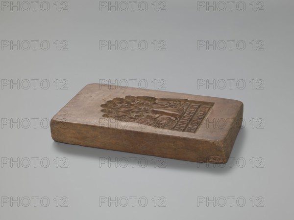 Double-sided gingerbread mould; obverse: group of figures — two women and a child; reverse: group of figures — a man surrounded by women and children. Gingerbread mould, gingerbread decorative art, double-sided rectangular form. Female figures in rich 17th–18th-century dresses with low necklines and wigs; a child probably a boy in a long shirt, culottes and stockings holding a toy; both women hold baskets and one holds a hare; small dog at the bottom. Obverse inscription in German: LIEBES KIND DENCK DOCH / NECHEN WELCHEN KAM GERG, NOCH. Reverse scene: a man surrounded by five women and two girls, all in 17th–18th-century costume; the man wearing a justokor, culottes and stockings; bottom German inscription: MICH ALTEN MAN / WOLEN IHRER HAHN. 19th century, Silesia Province of Silesia, 1742–1918. Dimensions: height 28 cm, width 17.3 cm, depth 4 cm., A rectangular wooden block with a carved recessed design on its top surface rests on a smooth pale gray background; the block appears worn w...