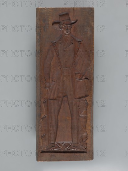 Double-sided gingerbread mould. Side A: figure of a lady; Side B: figure of a bachelor. Woodcarver or gingerbread, Rectangular form, 19th century dated 1842. Silesia Province of Silesia, 1742–1918. Height 84.5 cm, width 32 cm, depth 4 cm. One side: male figure in a high hat with a cane, outfit from the first half of the 19th century—frock coat, coat, checked trousers; a dog at his feet standing on its hind legs. Other side: female figure wearing a decorative bonnet and a long patterned dress with numerous ruffles and ribbons, holding a fan and a handbag in her right hand and a bunch of feathers in her left. Under the legs of both figures is plant decoration. Carved on the edge: decorative letters ACL a. P, initials of the maker or owner of the form. Folk motifs, floral ornaments, decorative art; used as a mold for gingerbread., A carved wooden panel shows a full-length relief of a standing figure wearing a tall brimmed hat and a long coat with wide lapels, with carved details indicatin...