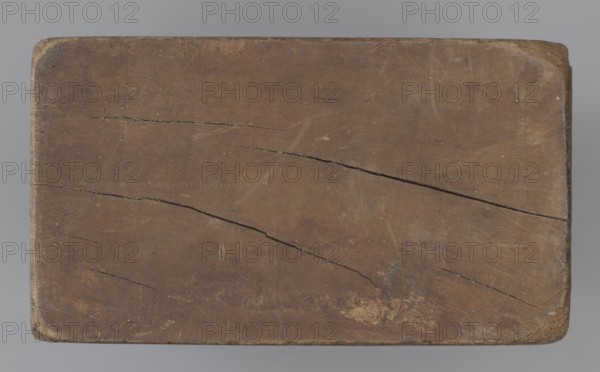 Double-sided gingerbread mould. Side A: figure of a lady in a decorative, pleated dress from the beginning of the 19th century, holding a bouquet of roses. Side B: stylised fish shown in profile, covered with scales. Rectangular wooden mould with an engraved date 1808 on the edge; in the middle of the date the letter S against the background of an anchor mark of the woodcarver or gingerbread maker. Materials: wood; type: form. Subject motifs: female figure in historical costume, flowers, fish, zoomorphic and folk motifs. Origin: Silesia Province of Silesia, 1742–1918. Dimensions: height 19.8 cm, width 7.3 cm, depth 4 cm. Maker: unknown woodcarver or gingerbread maker., A rectangular wooden board with rounded corners occupying most of the image, showing a worn brown surface with visible grain and several long dark cracks running diagonally and horizontally; the board has areas of lighter and darker brown wear, some small pale spots and scuffs, and a few faint scratches; the background a...