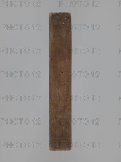 Double-sided gingerbread mould. Obverse: image of Madonna and Child; reverse: small image of Madonna in oval. Double-sided, rectangular form; on one side a figure of Madonna and Child, with a crown on her head, in a long patterned robe decorated with various geometric and plant motifs, the Madonna holds the Child in her left hand and a sword in her right; the other side: a smaller figure of the Madonna in an oval, surrounded by rays, the whole surrounded by a laurel wreath. Materials/function: gingerbread moulds decorative art, folk motifs, religious motifs. Iconography: Madonna and Child, crown, sword, wreath, female figures in rich dresses, Christianity. Date: 19th century. Place: Province of Silesia 1742–1918. Dimensions: height 25.8 cm, width 12 cm, depth 4.5 cm. Maker/, A long narrow rectangular wooden plank photographed against a plain light gray background, the plank showing a worn brown surface with darker and lighter brown variations, small circular pale spots and tiny holes s...