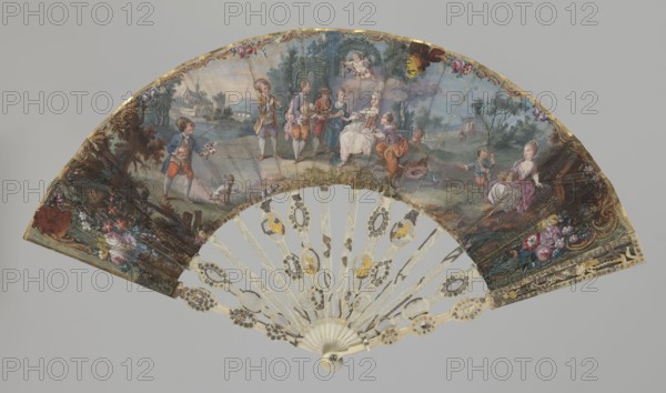 Fan, fans, fashion accessories, genre scenes, Rococo style, restitution noted. Double-sided fan with an ivory frame and painted paper covering. The obverse most likely depicts a marriage proposal, indicated by figures and symbolic props: a young lady seated in a park wearing a French-style dress, attended by a girl on a stone; a boy playing a flute; a shepherd holding a lamb; a gardener and a gardener with a basket of fruit; a young man with a bouquet and a dog on the left; a girl with an open birdcage on her lap and a boy holding a small bird on the right. Cupid, holding a garland of flowers, hovers above the group. The scene is surrounded by ornamentation of colorful flowers and gilt Rococo motifs. The reverse shows a shepherdess wandering alone in a park landscape, the edge decorated with a delicate blue Rococo ornament. In areas where the paper leaf is torn, elements cut from colored prints have been glued in: on the right side two caricatured male profiles; near the upper edge a g...