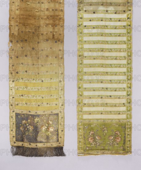 Kontusz sash, Royal Silk Manufactory in Grodno; silk fabric and belt manufacturer; 1768–1780. Polish half-solid, double-sided kontusz sash single-piece heads with asymmetrically arranged bouquets of roses, alternating transverse stripes plain and with floral twig motif, and floral twig edging. Fringe sewn on one end only gold. Ornament: heads—two floral bouquet motifs arranged antithetically and surrounded by a floral garland; center—alternating transverse shelves, plain and with a floral tendril motif; borders—vertical and horizontal with a tendril motif and interlacing lines or checkerboard. Colors: recto heads background gold; edges and shelves with tendril cream; ornament pink, green, blue; plain shelf gold. Verso heads, edges and shelves with tendril light green; ornament as on recto; plain shelf cream. Weave density: heads approx. 16/34 x2; smooth shelf approx. 16/24 x2; edges and shelf with tendril approx. 60/30 x2. Place of origin: Grodno Grand Duchy of Lithuania, Poland/Lithua...