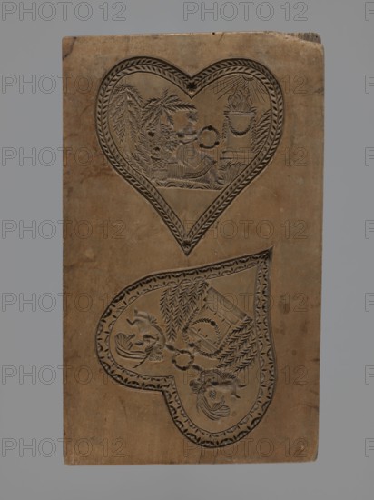 Double-sided gingerbread mould. Obverse: two representations; reverse: four representations. Figurative, genre scenes in folk-style decoration; hearts, altars, Cupid, wreaths, birds, sacrificial altar, erotic scenes. Double-sided rectangular form: one side with two heart-shaped fields — first: female figure in a long dress seated among palm trees, holding a wreath, in front of an altar decorated with a garland with fire burning on it, illuminated by sunrays; second: two cupids hovering over an altar decorated with garlands and holding a wreath. Other side with four hearts, each with a separate scene — first: a bird of paradise among branches; second: a young couple reclining on a chaise longue, with a temple illuminated by the sun and trees in the background; third: a cupid holding a wreath, hovering over an altar with burning fire surrounded by trees, bushes and flowers; fourth: a couple in love holding hands surrounded by trees and bushes. Applied decorative art; Silesia, 18th–19th c...