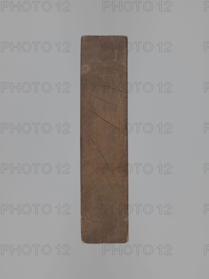 Double-sided gingerbread mould. Rectangular wooden form; obverse: image of a lion with an abundant mane, standing on a base decorated with plant-twig ornament, holding a ball engraved with the date 1829 and a symbol of an anchor intertwined with the letter S; floral and plant decoration at the bottom. Reverse: figure of a cavalier on horseback in early-19th-century riding attire jacket, breeches, top hat, holding a riding crop; at the horse's front legs a round shield engraved 1831 and the same anchor-and-S symbol mark of the woodcarver or owner; floral and plant ornament at the bottom. Materials/function: gingerbread mould; motifs: figurative scenes, lions, horse, historical costumes, plant motifs. Date marks: 1829 and 1831. Region: Province of Silesia 1742–1918. Dimensions: height 25.8 cm, width 19.4 cm, depth 4.3 cm. Creator: unknown., A vertical rectangular wooden plank with rounded corners occupies the center of the image against a smooth gray background; the plank is brown with v...