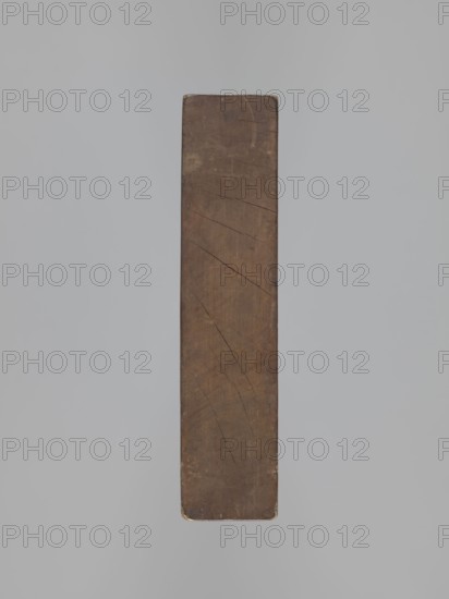 Double-sided gingerbread mould. Rectangular wooden form with carved images on each side: one side shows a lion with an abundant mane standing on a base decorated with plant-twig ornament, holding a ball engraved with the date 1829 and a mark of an anchor intertwined with the letter S; floral and plant decoration at the bottom. Reverse shows a cavalier on horseback in early 19th-century riding attire jacket, breeches, top hat, holding a riding crop; a round shield at the horse's front legs is engraved 1831 and bears the same anchor-and-S mark woodcarver's or owner's mark; floral and plant ornament at the bottom. Materials/genre: applied art; gingerbread mould. Iconography: rider on a horse, lion, animal and plant motifs; figurative scenes; historical costumes. Date inscriptions: 1829 and 1831. Region: Silesia Province of Silesia, Prussia, 1742–1918. Dimensions: height 25.8 cm, width 19.4 cm, depth 4.3 cm., A vertical rectangular wooden plank with worn edges and visible scratches and cra...