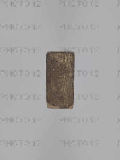 Double-sided gingerbread mold; obverse: female figure, reverse: baby in swaddling clothes. Woodcarving; gingerbread mold used for producing gingerbread. Folk-style decorations: female figure in Silesian folk costume with a bonnet, large bow tied under the neck, long dress with short puffed sleeves, dress hem decorated with floral and plant ornament; figure holds a basket with flowers. Reverse shows a baby in decorative swaddling clothes. Applied/decorative art. Single-sided rectangular form double-sided images. 18th–19th century, Province of Silesia 1742–1918., A single rectangular block with rounded corners is centered against a uniform pale gray background; the block appears wooden with a worn surface showing a mix of brown and dark brown tones, faint streaks of yellowish discoloration, subtle cracks and small pits, and areas of lighter beige near the edges.